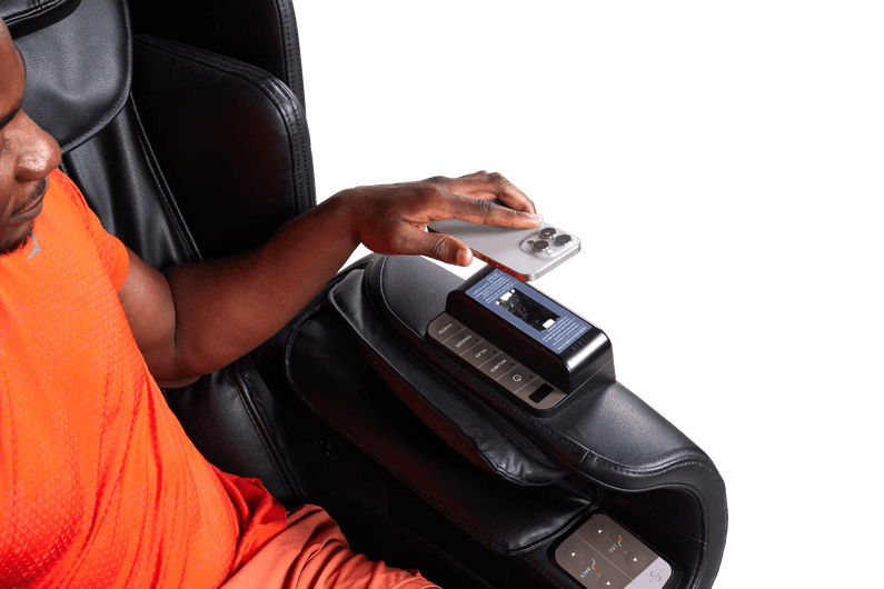 Man scanning a QR code to use a massage chair at Basic-Fit.